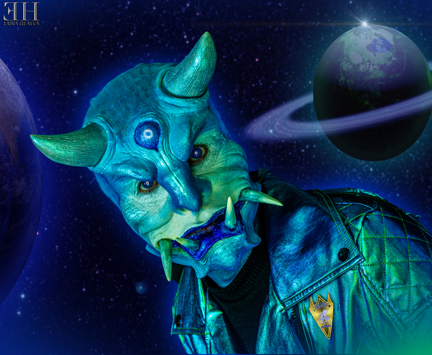 A character with blue skin, horns, and unique makeup poses in front of a cosmic background featuring planets and stars.
