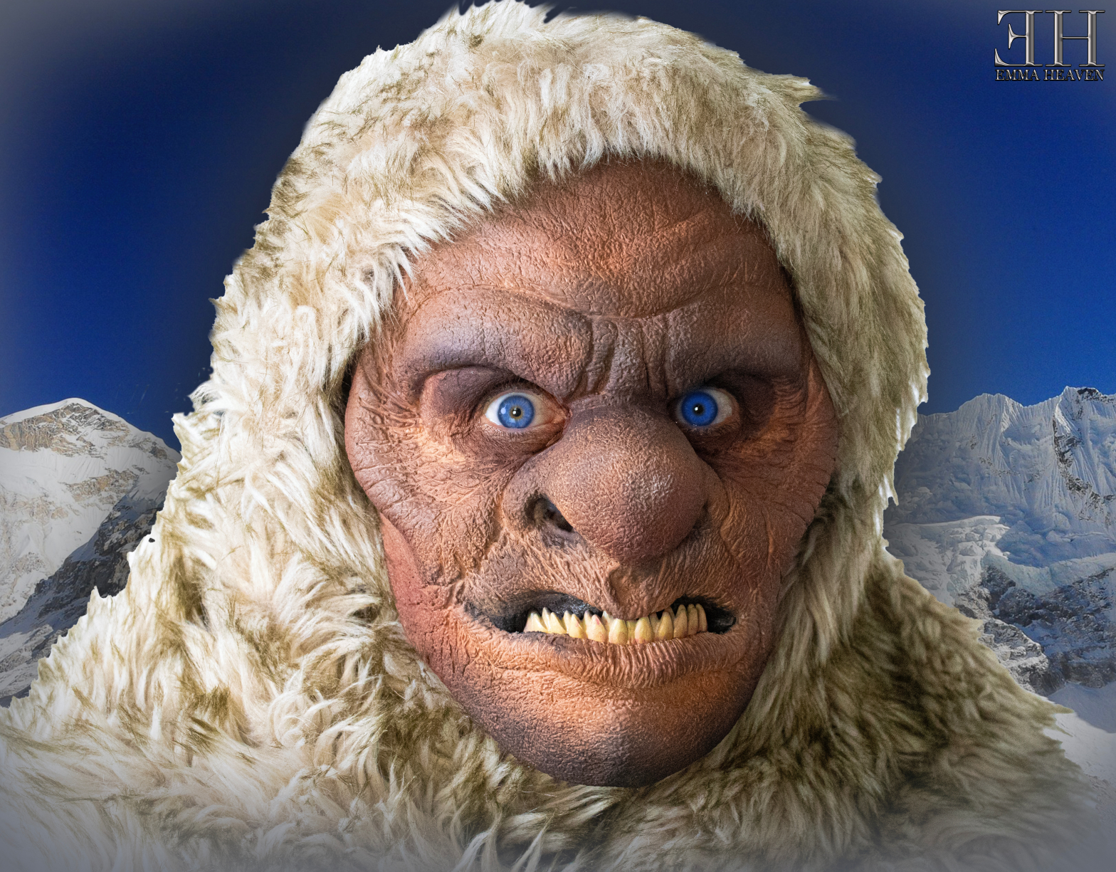 Close-up of a furry creature with a fierce expression, large blue eyes, and pointed teeth, set against a mountainous landscape.